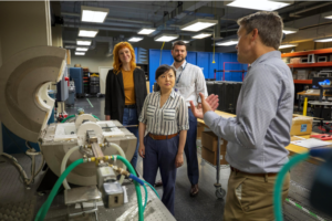 Dr. Ellen Mazumdar (center) and her team discuss material measurement techniques. (Also pictured from left: Dr. Aimee Williams, Dr. Kenneth Allen and Dr. David Reid)